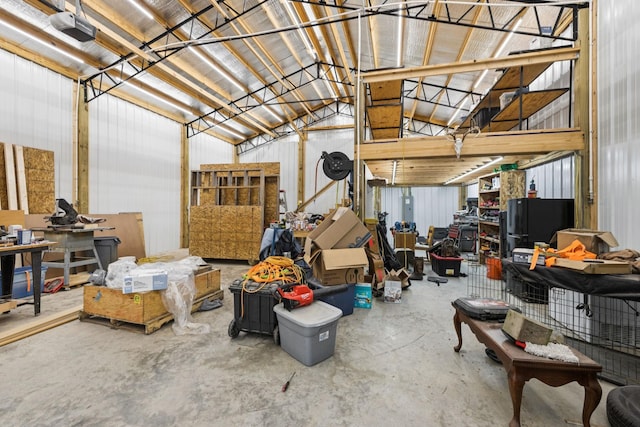 345 Big Spring Hollow Rd, Pulaski, TN 38478 - garage with a garage door opener and freestanding refrigerator