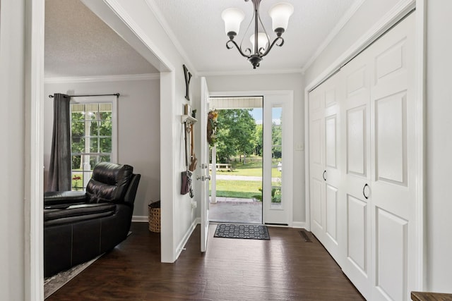 345 Big Spring Hollow Rd, Pulaski, TN 38478 - foyer entrance featuring a chandelier, healthy amount of natural light, dark wood-type flooring, ornamental molding, and baseboards