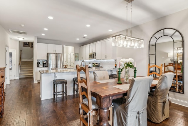 2037 Flowing Creek Dr, Franklin, TN 37064 - dining room featuring recessed lighting, dark wood-style flooring, stairs, and baseboards