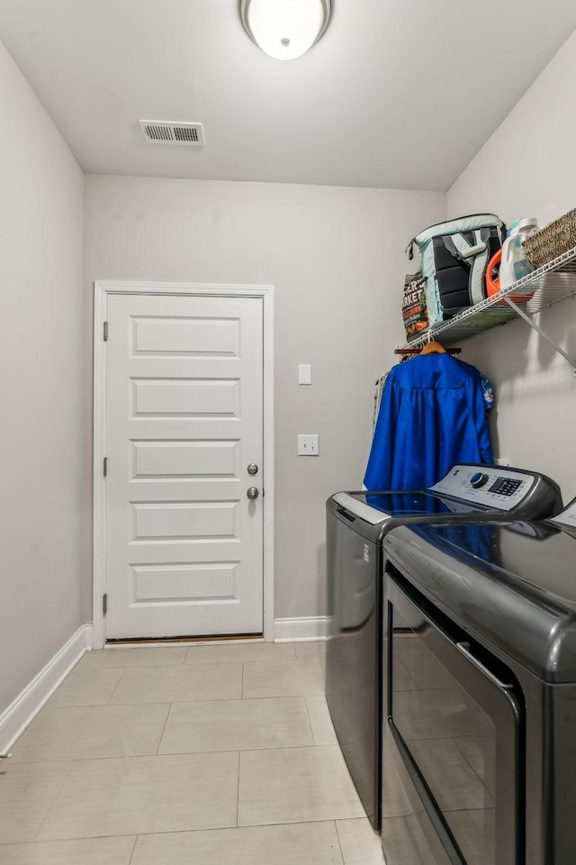 2037 Flowing Creek Dr, Franklin, TN 37064 - laundry area with washer and dryer, baseboards, and light tile patterned flooring