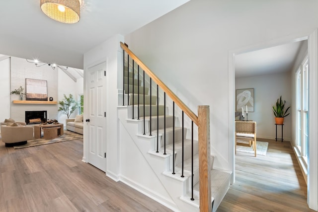 4900 Chesterfield Dr, Murfreesboro, TN 37127 - stairway with wood finished floors, a brick fireplace, and baseboards