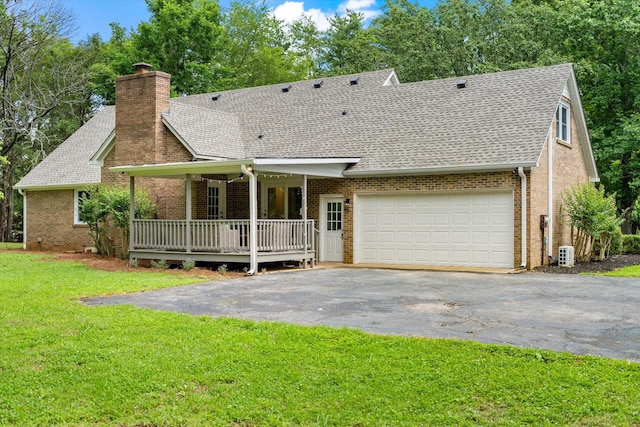4900 Chesterfield Dr, Murfreesboro, TN 37127 - back of property featuring asphalt driveway, roof with shingles, covered porch, and a chimney
