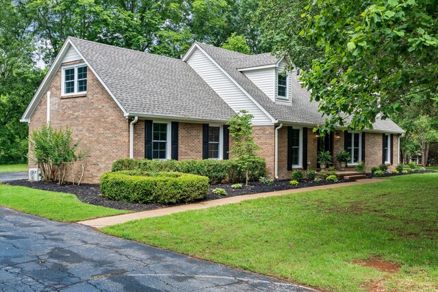4900 Chesterfield Dr, Murfreesboro, TN 37127 - cape cod home featuring a front lawn, brick siding, and roof with shingles