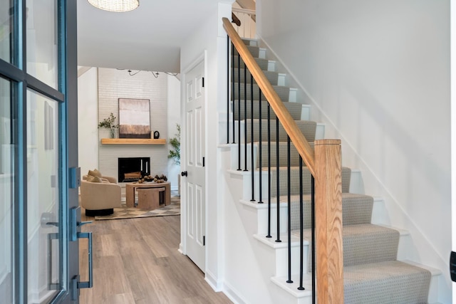 4900 Chesterfield Dr, Murfreesboro, TN 37127 - staircase featuring wood finished floors and a large fireplace
