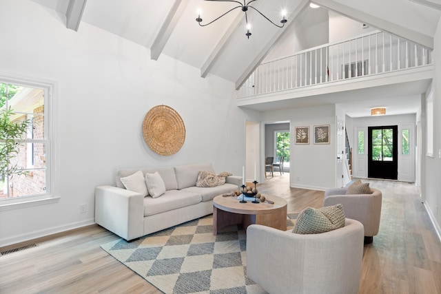 4900 Chesterfield Dr, Murfreesboro, TN 37127 - living room featuring a chandelier, wood finished floors, high vaulted ceiling, beamed ceiling, and baseboards