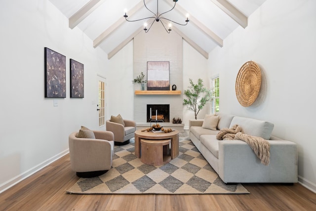 4900 Chesterfield Dr, Murfreesboro, TN 37127 - living room featuring a chandelier, beamed ceiling, baseboards, wood finished floors, and a fireplace