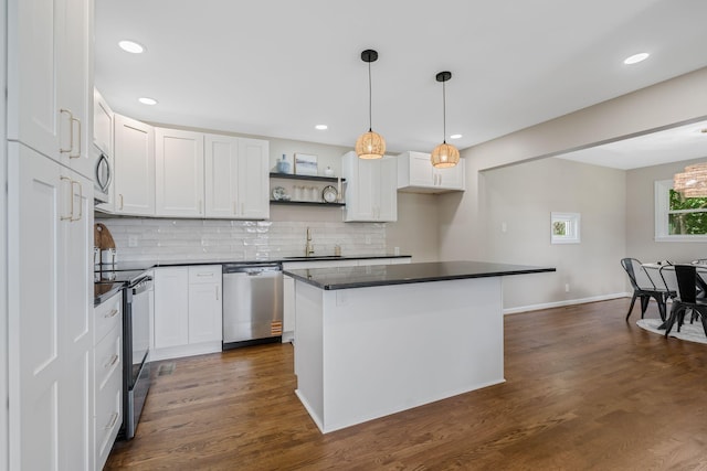 209 Franklin Park, Winchester, TN 37398 - kitchen with appliances with stainless steel finishes, dark countertops, open shelves, white cabinets, and decorative backsplash