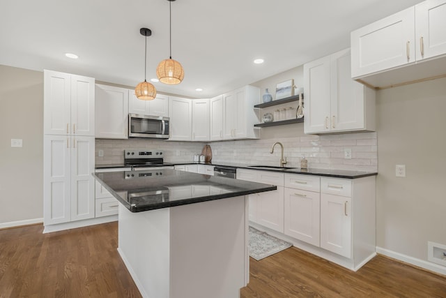 209 Franklin Park, Winchester, TN 37398 - kitchen featuring appliances with stainless steel finishes, open shelves, white cabinets, dark wood-style floors, and recessed lighting