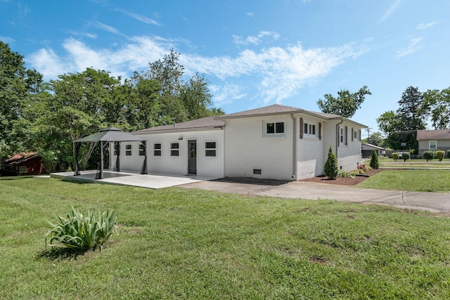 209 Franklin Park, Winchester, TN 37398 - rear view of house with a patio, brick siding, and a yard
