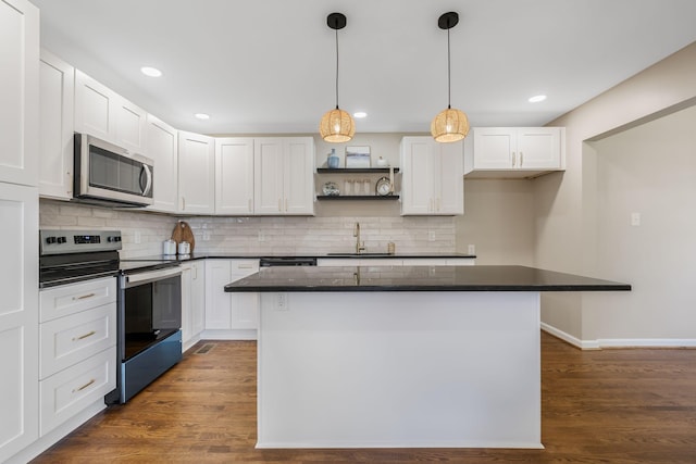 209 Franklin Park, Winchester, TN 37398 - kitchen featuring stainless steel appliances, open shelves, white cabinetry, a kitchen island, and backsplash