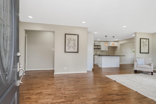 209 Franklin Park, Winchester, TN 37398 - unfurnished living room featuring dark wood-style flooring and recessed lighting