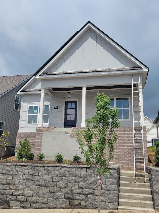 4810 Kintore, Nolensville, TN 37135 - view of front of property featuring board and batten siding, brick siding, and covered porch