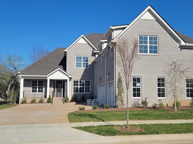 1128 Hibiscus Ln, Nolensville, TN 37135 - traditional-style house featuring brick siding, concrete driveway, and an attached garage