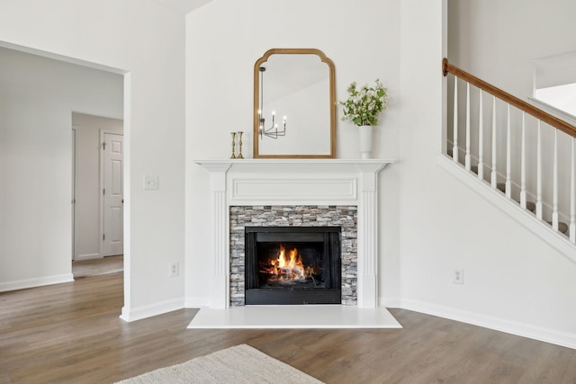 3065 Sakari Cir, Spring Hill, TN 37174 - living area featuring wood finished floors, a chandelier, a fireplace, stairway, and baseboards