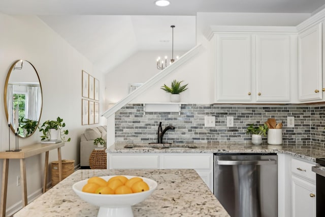 3065 Sakari Cir, Spring Hill, TN 37174 - kitchen featuring dishwasher, a sink, backsplash, white cabinets, and vaulted ceiling