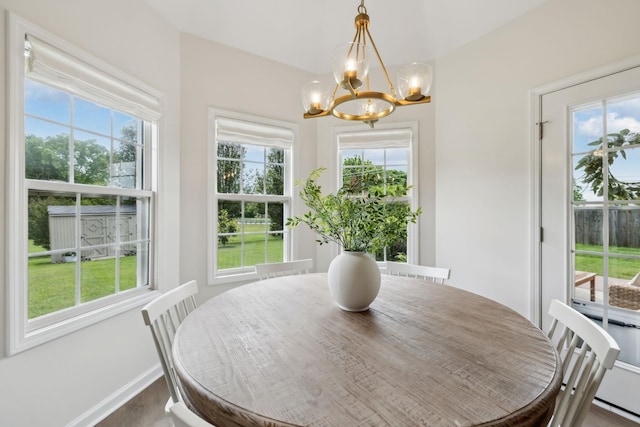 3065 Sakari Cir, Spring Hill, TN 37174 - dining area featuring a chandelier, dark wood-style floors, healthy amount of natural light, and baseboards