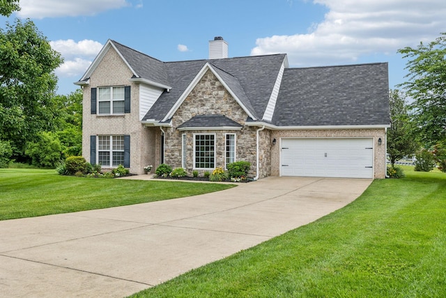 3065 Sakari Cir, Spring Hill, TN 37174 - view of front facade featuring driveway, a front yard, an attached garage, and a chimney