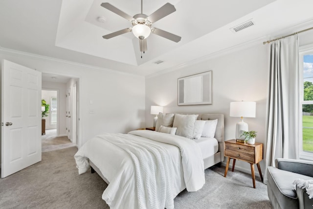 3065 Sakari Cir, Spring Hill, TN 37174 - bedroom featuring a tray ceiling, light colored carpet, crown molding, and a ceiling fan