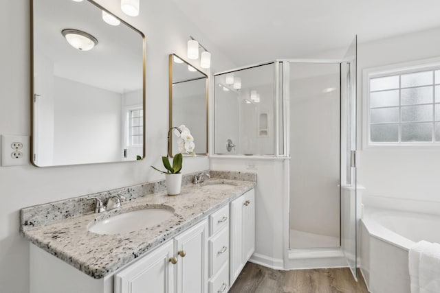 3065 Sakari Cir, Spring Hill, TN 37174 - full bath with a stall shower, double vanity, a bath, and wood finished floors