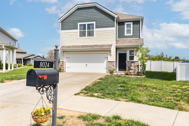 8024 Craighead Dr, Lebanon, TN 37087 - view of front of house featuring driveway, an attached garage, and stone siding