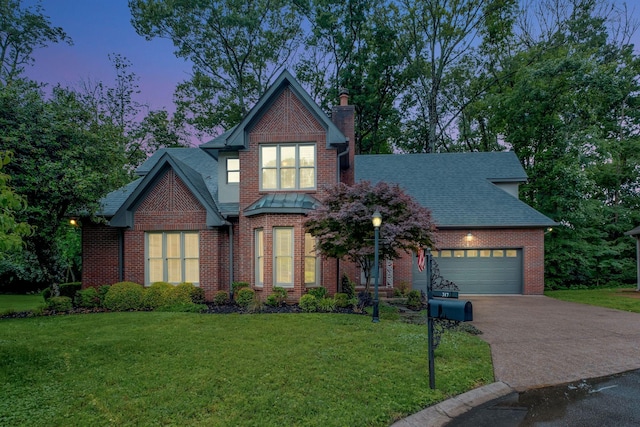 317 Ketch Cv, Hermitage, TN 37076 - view of front of house featuring roof with shingles, a chimney, a garage, and driveway