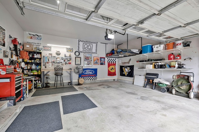 317 Ketch Cv, Hermitage, TN 37076 - garage featuring a garage door opener and a workshop area