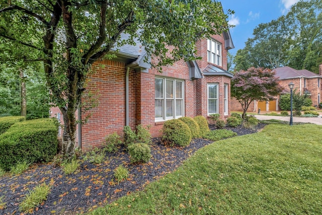317 Ketch Cv, Hermitage, TN 37076 - view of side of home featuring brick siding and a yard