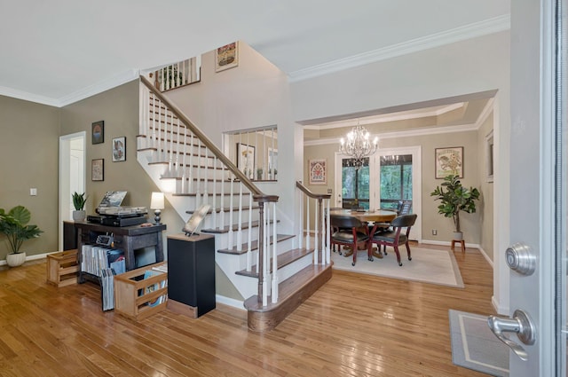 317 Ketch Cv, Hermitage, TN 37076 - foyer entrance with stairs, ornamental molding, wood finished floors, a chandelier, and baseboards
