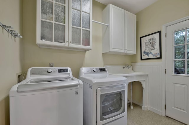317 Ketch Cv, Hermitage, TN 37076 - washroom featuring cabinet space, separate washer and dryer, and light carpet