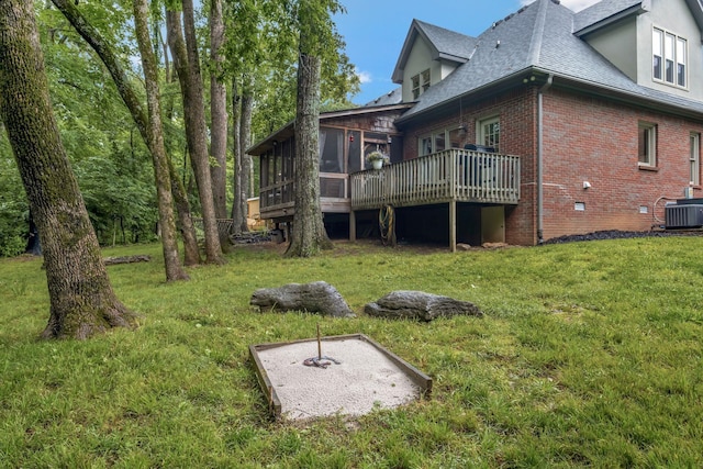 317 Ketch Cv, Hermitage, TN 37076 - rear view of house featuring a sunroom, central air condition unit, brick siding, roof with shingles, and a wooden deck