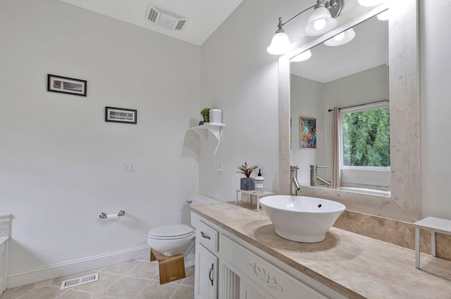 317 Ketch Cv, Hermitage, TN 37076 - bathroom with vanity, tile patterned floors, toilet, and baseboards