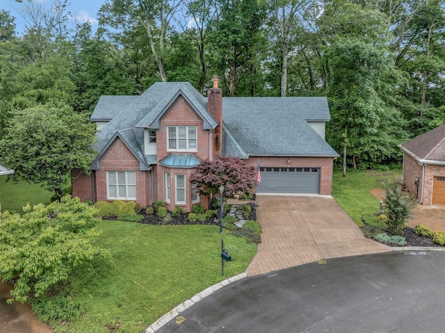 317 Ketch Cv, Hermitage, TN 37076 - view of front of property with a chimney, roof with shingles, brick siding, and a garage