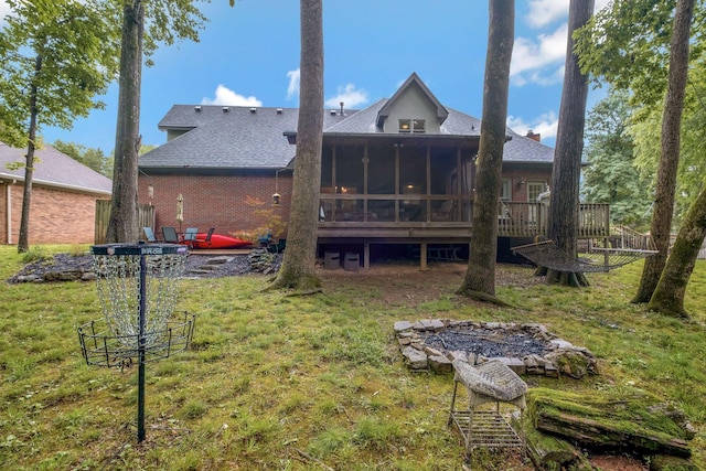 317 Ketch Cv, Hermitage, TN 37076 - back of property with a sunroom, roof with shingles, a lawn, and a deck