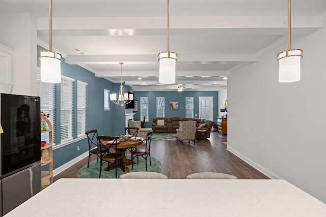 1308 Belgove Aly, Antioch, TN 37013 - dining area featuring dark wood finished floors, beam ceiling, baseboards, crown molding, and a ceiling fan
