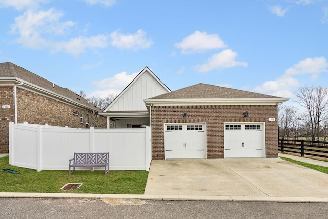 1308 Belgove Aly, Antioch, TN 37013 - view of property exterior featuring board and batten siding, brick siding, driveway, and a garage