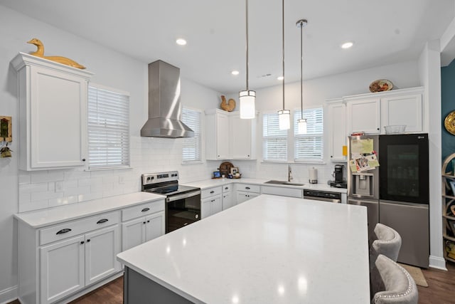 1308 Belgove Aly, Antioch, TN 37013 - kitchen featuring stainless steel appliances, wall chimney range hood, a sink, a kitchen island, and backsplash