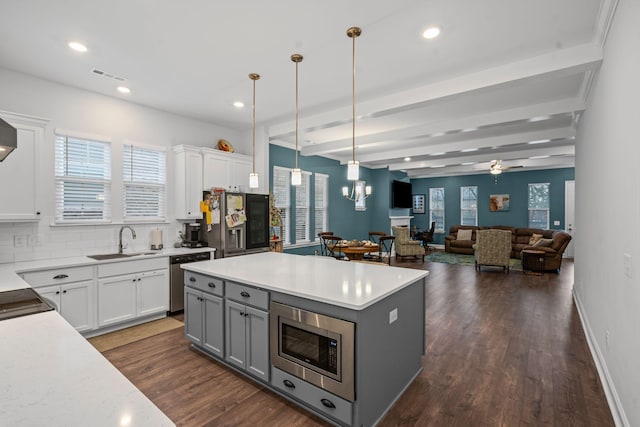 1308 Belgove Aly, Antioch, TN 37013 - kitchen with a sink, stainless steel appliances, gray cabinets, dark wood-style floors, and hanging light fixtures