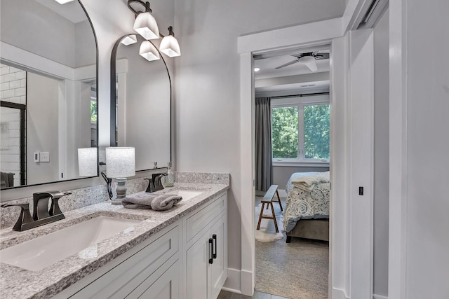 2670 Morgan Rd, Joelton, TN 37080 - ensuite bathroom with double vanity, baseboards, and ceiling fan