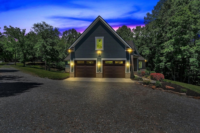 2670 Morgan Rd, Joelton, TN 37080 - view of front of property featuring asphalt driveway, an attached garage, and brick siding