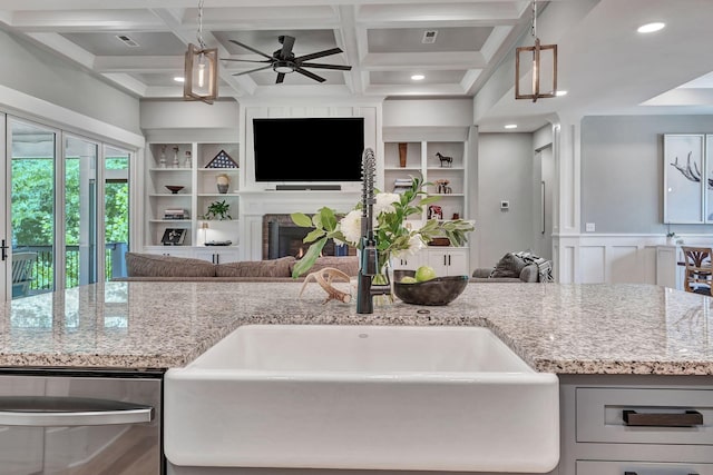 2670 Morgan Rd, Joelton, TN 37080 - kitchen with open floor plan, stainless steel dishwasher, a sink, light stone counters, and coffered ceiling