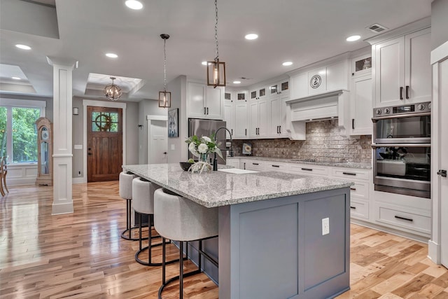 2670 Morgan Rd, Joelton, TN 37080 - kitchen with appliances with stainless steel finishes, tasteful backsplash, white cabinets, and recessed lighting