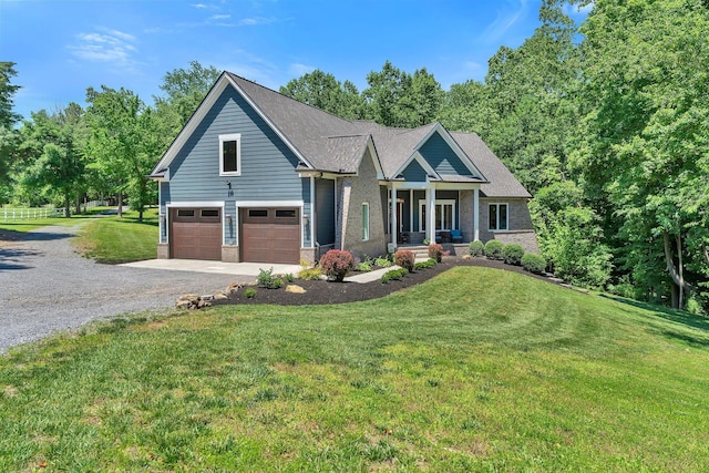 2670 Morgan Rd, Joelton, TN 37080 - craftsman-style home featuring driveway, brick siding, a front lawn, and a garage