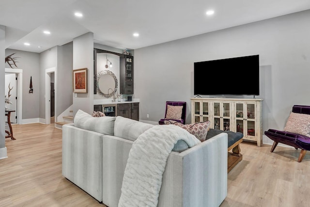 2670 Morgan Rd, Joelton, TN 37080 - living room featuring light wood-style floors, recessed lighting, bar area, and baseboards