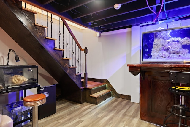 916 Lion Pkwy, Columbia, TN 38401 - bar featuring wood finished floors, stairs, and baseboards