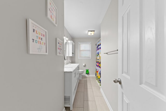 916 Lion Pkwy, Columbia, TN 38401 - bathroom with vanity, baseboards, toilet, tile patterned floors, and curtained shower