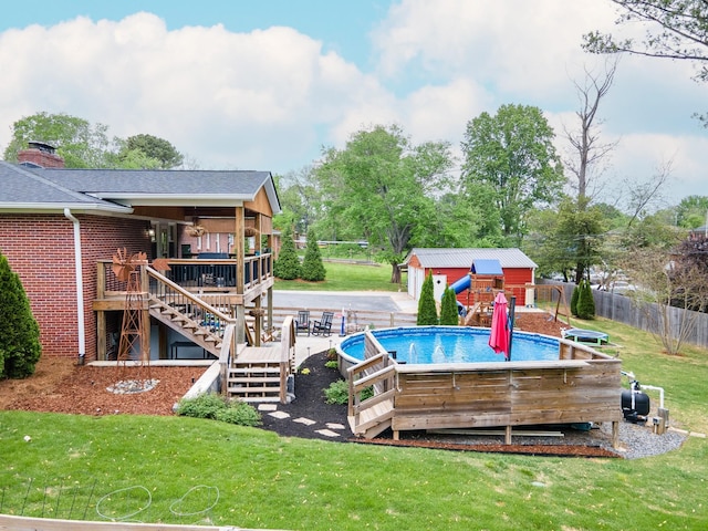 916 Lion Pkwy, Columbia, TN 38401 - swimming pool featuring a wooden deck, stairway, and an outbuilding