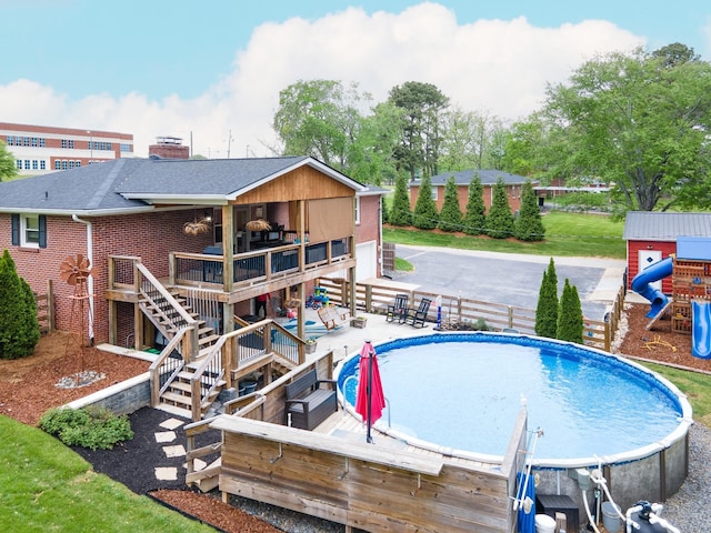 916 Lion Pkwy, Columbia, TN 38401 - outdoor pool featuring a wooden deck and stairway