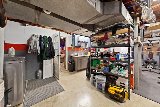 916 Lion Pkwy, Columbia, TN 38401 - unfinished basement featuring washer / clothes dryer, a workshop area, and concrete block wall
