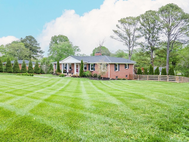 916 Lion Pkwy, Columbia, TN 38401 - view of front of house featuring a chimney, brick siding, and covered porch