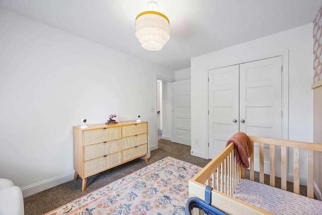 800 Snapdragon Ct, Clarksville, TN 37042 - bedroom with a closet, baseboards, a chandelier, and dark colored carpet
